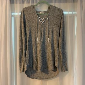 Women’s grey pullover sweater with cross detail